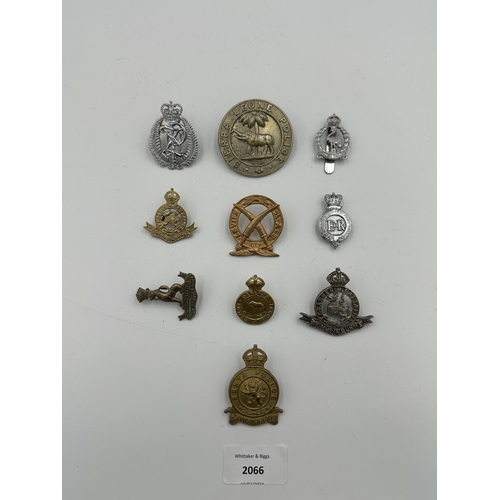 2066 - Ten military cap badges