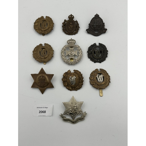 2068 - Ten military cap badges