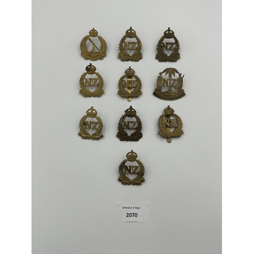 2070 - Ten military cap badges