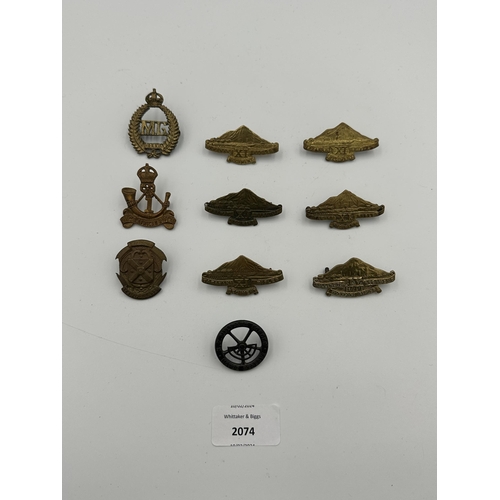 2074 - Ten military cap badges