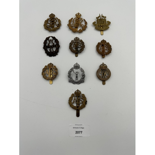 2077 - Ten military cap badges