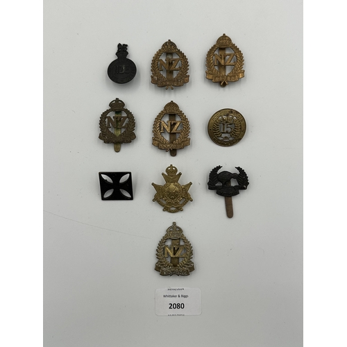 2080 - Ten military cap badges