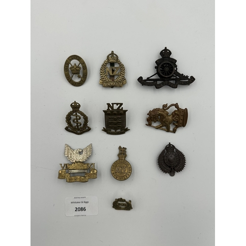 2086 - Ten military cap badges