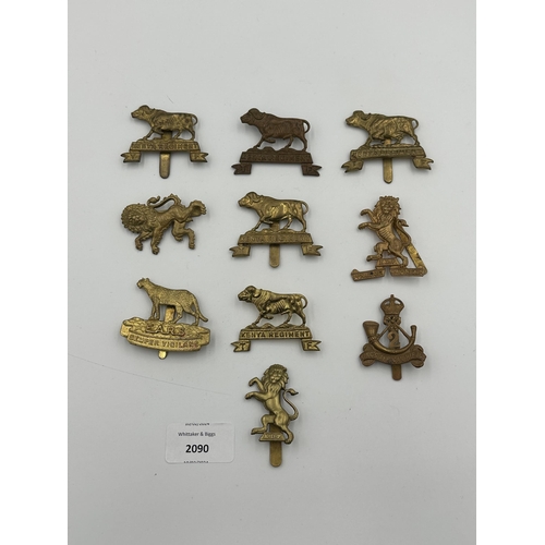 2090 - Ten military cap badges