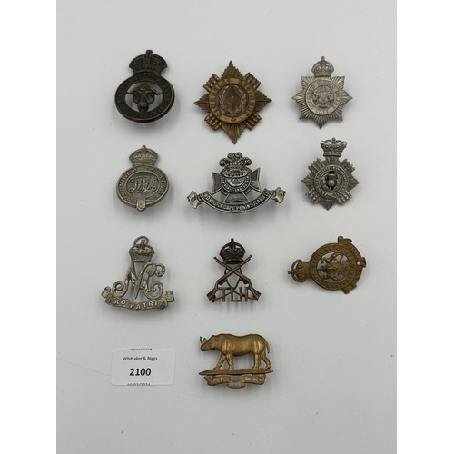 2100 - Ten military cap badges