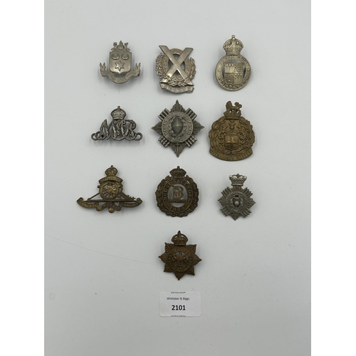 2101 - Ten military cap badges