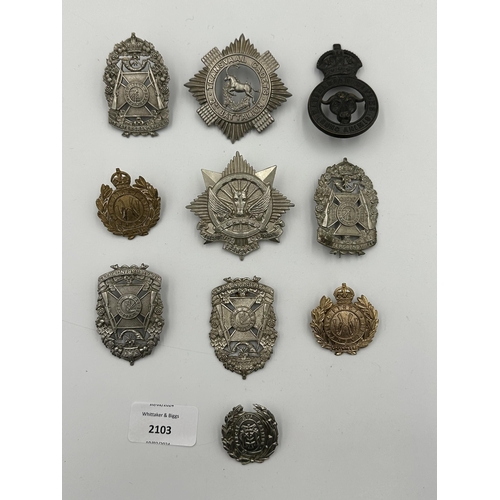 2103 - Ten military cap badges