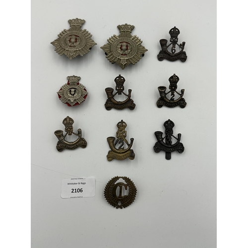 2106 - Ten military cap badges