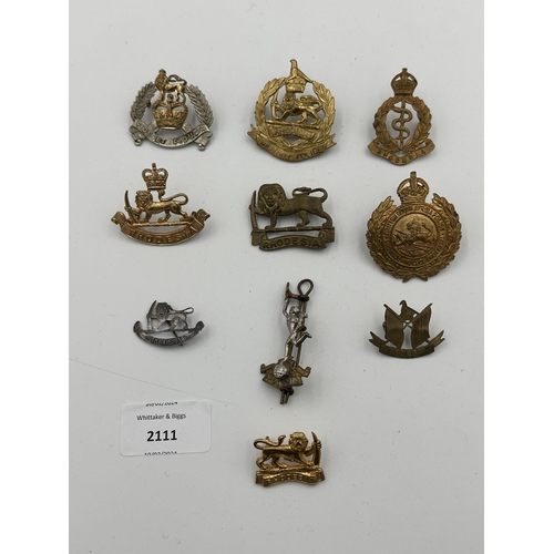 2111 - Ten military cap badges