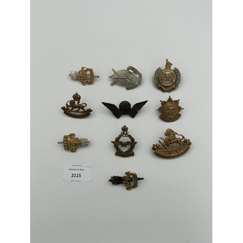 2115 - Ten military cap badges