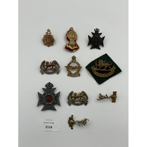 2116 - Ten military cap badges