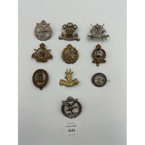 2121 - Ten military cap badges