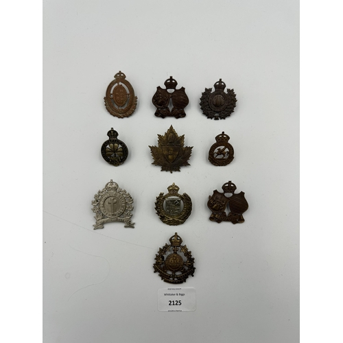 2125 - Ten military cap badges