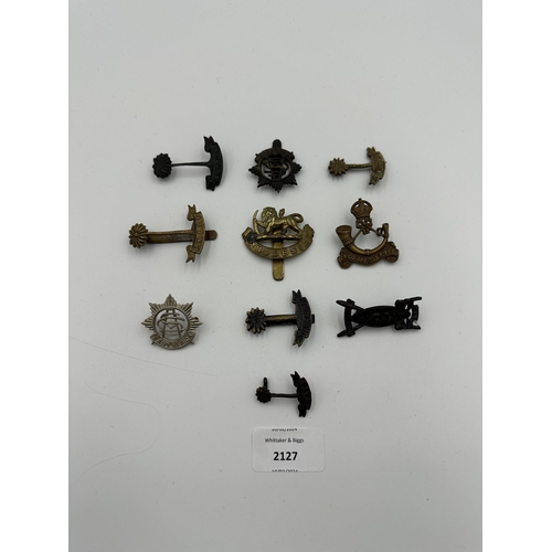 2127 - Ten military cap badges