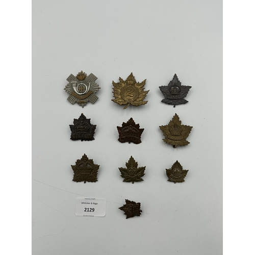 2129 - Ten military cap badges