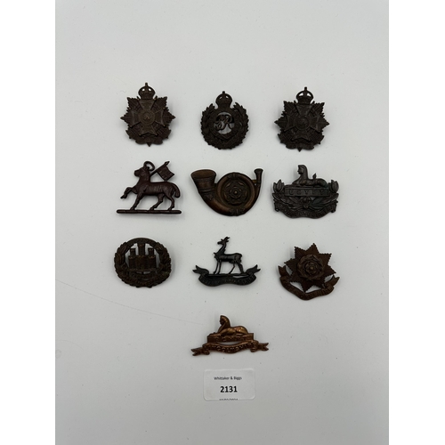 2131 - Ten military cap badges