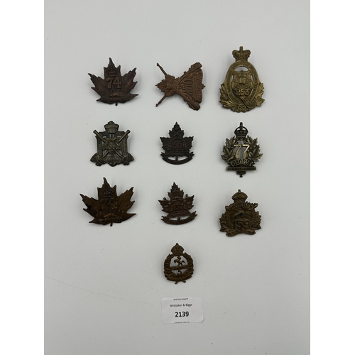 2139 - Ten military cap badges