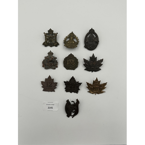 2141 - Ten military cap badges