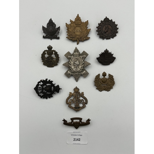 2142 - Ten military cap badges