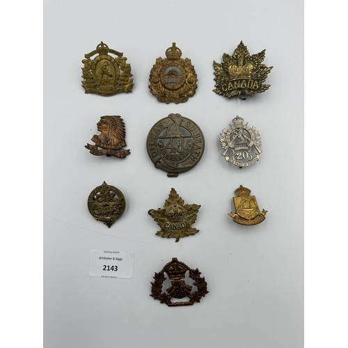 2143 - Ten military cap badges