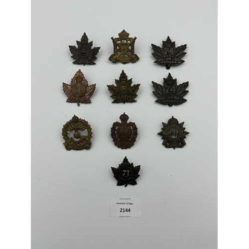 2144 - Ten military cap badges