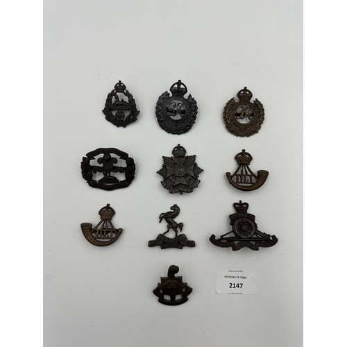 2147 - Ten military cap badges