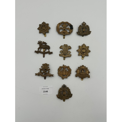 2148 - Ten military cap badges