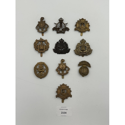 2154 - Ten military cap badges