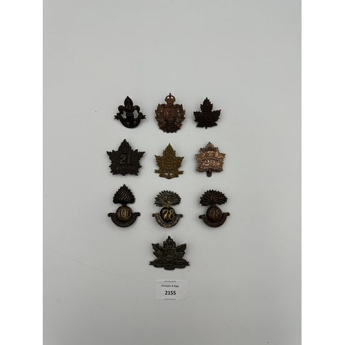 2155 - Ten military cap badges