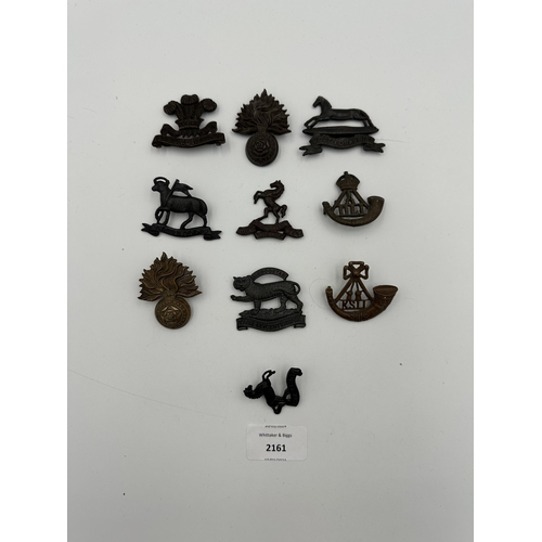 2161 - Ten military cap badges