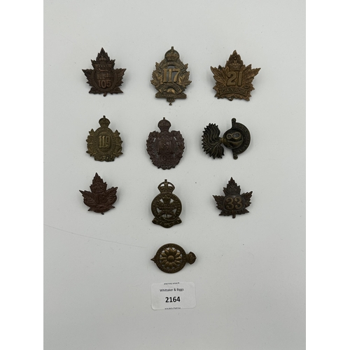 2164 - Ten military cap badges