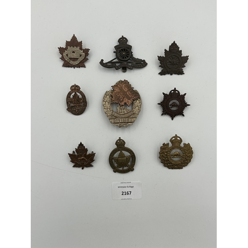 2167 - Nine military cap badges