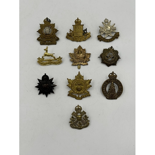 2180 - Ten military cap badges