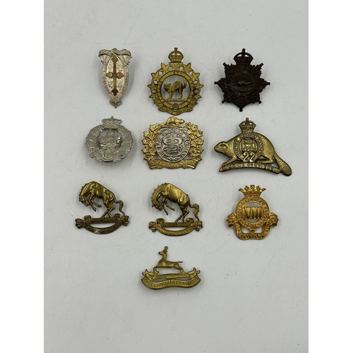 2181 - Ten military cap badges