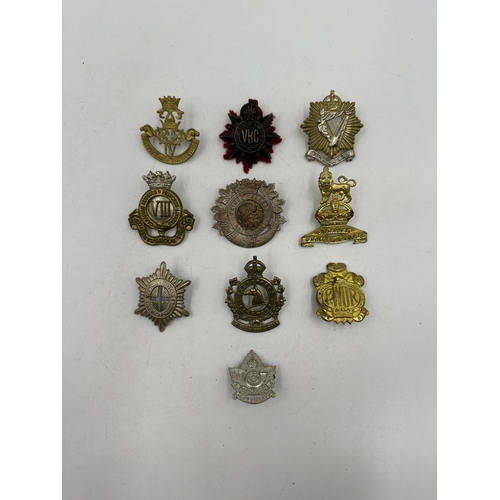 2184 - Ten military cap badges