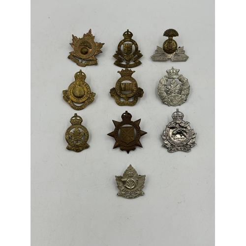 2185 - Ten military cap badges