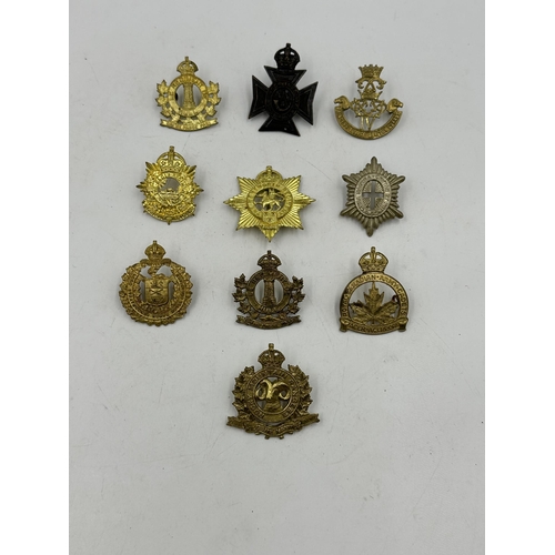 2186 - Ten military cap badges