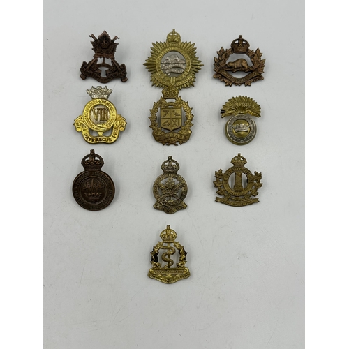 2194 - Ten military cap badges