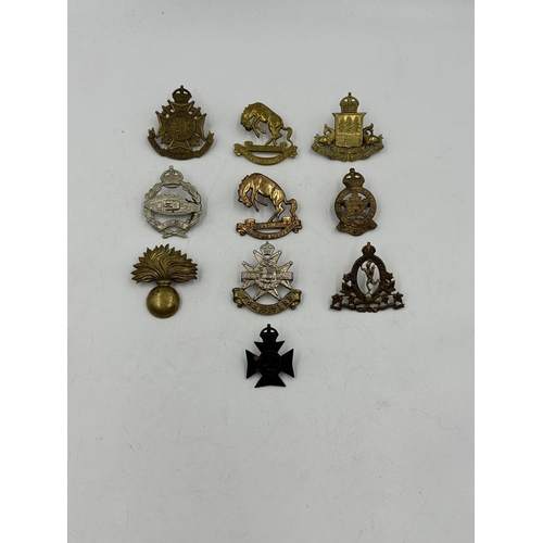 2196 - Ten military cap badges