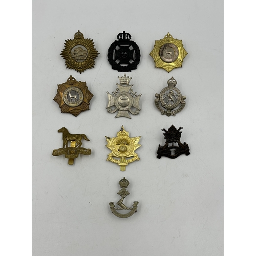 2198 - Ten military cap badges