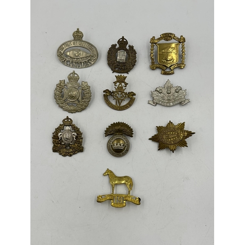 2199 - Ten military cap badges