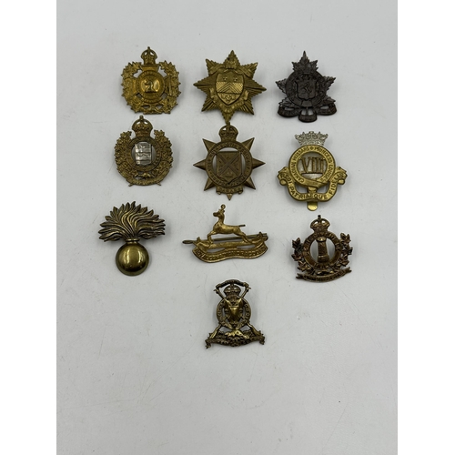 2201 - Ten military cap badges