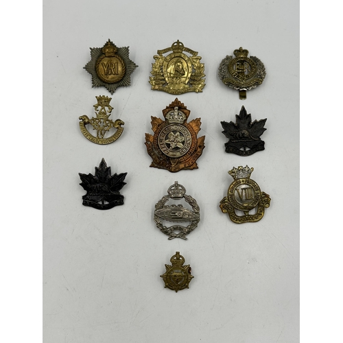 2202 - Ten military cap badges