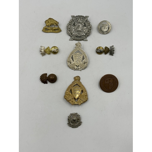 2203 - Ten military cap badges