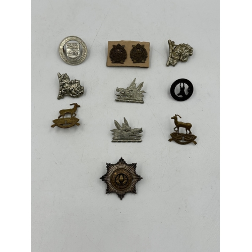 2204 - Ten military cap badges