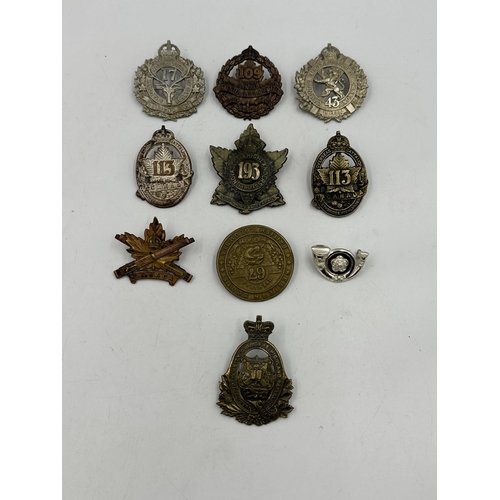 2205 - Ten military cap badges