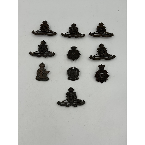 2206 - Ten military cap badges