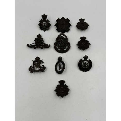 2207 - Ten military cap badges