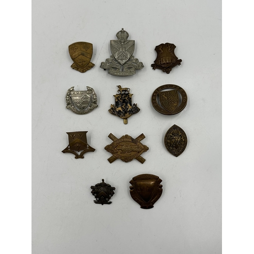 2233 - Eleven military cap badges