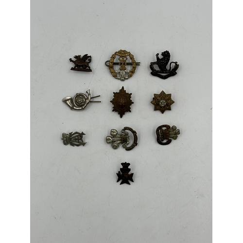 2238 - Ten military cap badges